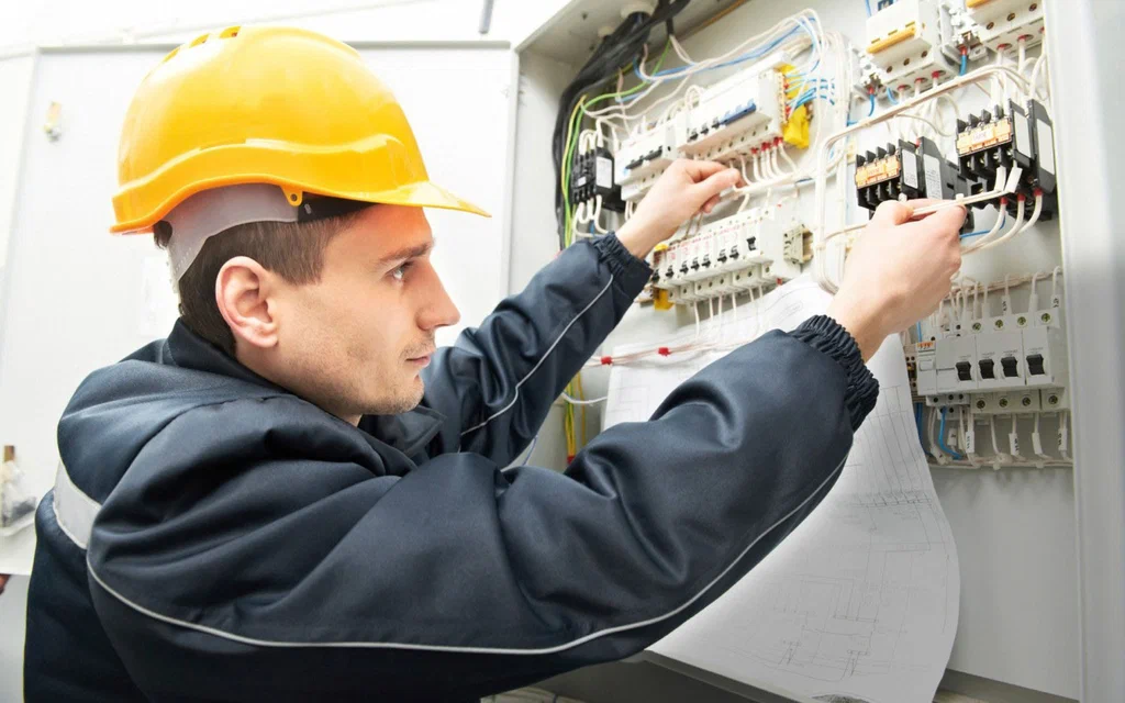 Electrician studying a diagram